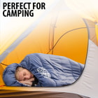 Full image of a person sleeping in the SummitSnooze Mummy Sleeping Bag.